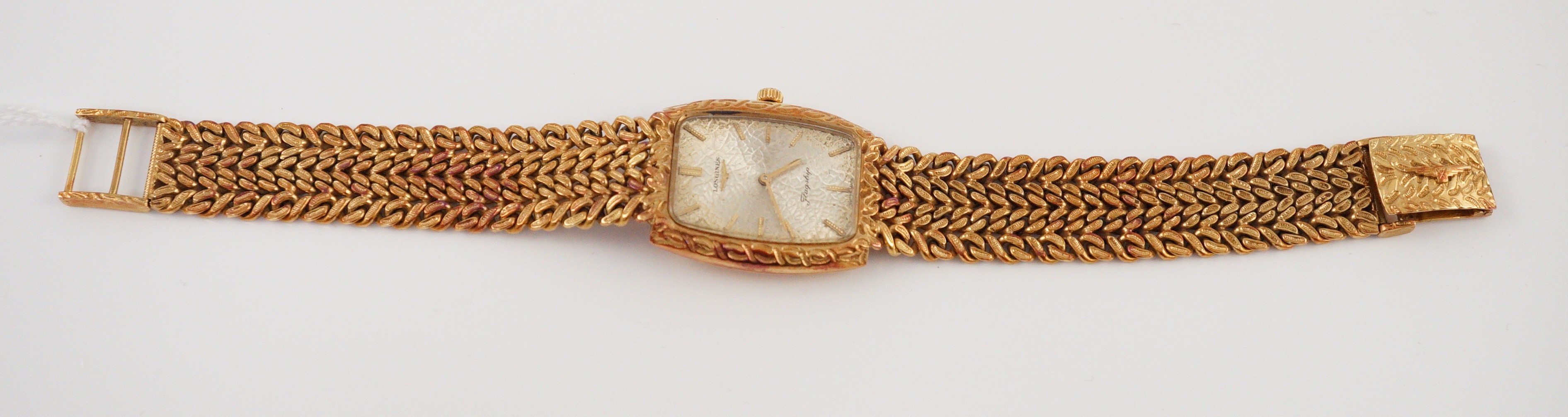 A gentleman's 1980's 18ct gold Longines Flagship manual wind tonneau shaped dress wrist watch